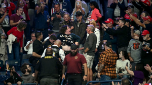 Trump rally heckler punched during Ohio event as crowd chants Trump rally heckler punched during Ohio event as crowd chants